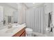 Bathroom featuring a single sink vanity and a shower with curtain at 9997 Town Lake Dr, Orlando, FL 32832