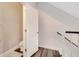 Upstairs hall bathroom area with a doorway and stairwell at 9997 Town Lake Dr, Orlando, FL 32832