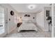 Inviting bedroom featuring a cozy bed, stylish decor, and ample natural light at 9997 Town Lake Dr, Orlando, FL 32832