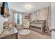 Charming Bedroom with crib, changing table, and wallpaper at 9997 Town Lake Dr, Orlando, FL 32832