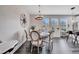 Charming dining area featuring elegant furnishings and abundant natural light from large windows at 9997 Town Lake Dr, Orlando, FL 32832