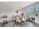 Bright dining room features a round table with chairs, modern lighting, and lots of natural light at 9997 Town Lake Dr, Orlando, FL 32832