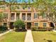 Inviting townhouse with a well-manicured lawn, tidy landscaping, and charming front porches at 9997 Town Lake Dr, Orlando, FL 32832