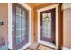 The dual front doors welcome guests to this beautifully-maintained townhouse at 9997 Town Lake Dr, Orlando, FL 32832