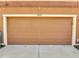 Garage door in a townhome featuring the house number 9997 at 9997 Town Lake Dr, Orlando, FL 32832