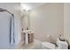 Cozy half bath with pedestal sink, oval mirror, and soft neutral tones at 9997 Town Lake Dr, Orlando, FL 32832