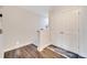 Bright hallway with wood floors and a white closet door on the right at 9997 Town Lake Dr, Orlando, FL 32832