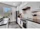 Modern kitchen features stone countertops, subway tile backsplash, and stainless steel appliances at 9997 Town Lake Dr, Orlando, FL 32832
