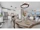 Open floor plan with kitchen, dining, and living room with great lighting and neutral color palette at 9997 Town Lake Dr, Orlando, FL 32832