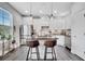 Modern kitchen boasts stainless steel appliances, stone countertops, and stylish pendant lighting at 9997 Town Lake Dr, Orlando, FL 32832