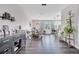Spacious living area with modern decor, connecting kitchen, dining, and bar at 9997 Town Lake Dr, Orlando, FL 32832