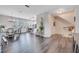 Open-concept living area showcasing dining, kitchen, and stairs at 9997 Town Lake Dr, Orlando, FL 32832