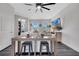 Inviting living room featuring an open concept, comfortable seating, and a large flat-screen TV at 9997 Town Lake Dr, Orlando, FL 32832