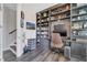 Well-appointed office with extensive shelving, perfect for remote work at 9997 Town Lake Dr, Orlando, FL 32832