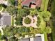 Aerial shot of a community park area with seating surrounded by lush landscaping and a brick sidewalk at 9997 Town Lake Dr, Orlando, FL 32832