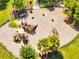 Aerial view of a modern community playground with slides and climbing structures at 9997 Town Lake Dr, Orlando, FL 32832