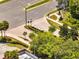 Aerial view of the community entrance including sidewalks, street signs, and crosswalks at 9997 Town Lake Dr, Orlando, FL 32832