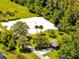 Aerial shot of volleyball court with pavilion and picnic area surrounded by trees at 9997 Town Lake Dr, Orlando, FL 32832