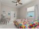 Bedroom with a ceiling fan, closet, window, and desk at 10254 Hart Branch Cir, Orlando, FL 32832