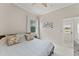 Bedroom with a ceiling fan, closet, window, and grey furniture at 10254 Hart Branch Cir, Orlando, FL 32832
