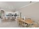 Bright kitchen and breakfast nook with white cabinets, stainless steel appliances, and breakfast bar at 10254 Hart Branch Cir, Orlando, FL 32832