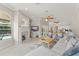 Open-concept living room with fireplace, large windows, and view of the pool at 10254 Hart Branch Cir, Orlando, FL 32832