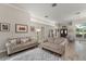 Open living room featuring wood-look tile and a smooth transition to the foyer at 10254 Hart Branch Cir, Orlando, FL 32832