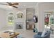Bright living room with fireplace, large windows, and sliding door to outdoor patio at 10254 Hart Branch Cir, Orlando, FL 32832