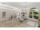 Expansive living room featuring wood-look tile floors and ample natural light at 10254 Hart Branch Cir, Orlando, FL 32832