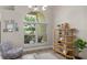 Bright living room with large window showcasing outdoor view and display shelving at 10254 Hart Branch Cir, Orlando, FL 32832