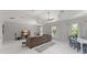 Spacious living room featuring neutral tones, comfortable seating, and a large entertainment center at 10254 Hart Branch Cir, Orlando, FL 32832