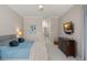 Spacious main bedroom with ceiling fan, TV, and ensuite bathroom at 10254 Hart Branch Cir, Orlando, FL 32832
