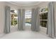 Main bedroom bay window with view of lush landscaping and pool at 10254 Hart Branch Cir, Orlando, FL 32832