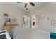 Bright office space with neutral walls, white carpet, modern furnishings and view into bathroom and bedroom at 10254 Hart Branch Cir, Orlando, FL 32832