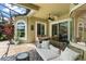 Enclosed patio with an outdoor dining area and comfortable seating, perfect for relaxing by the pool at 10254 Hart Branch Cir, Orlando, FL 32832