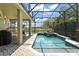 A pristine screened-in pool with a jacuzzi, overlooking the golf course, perfect for relaxation and entertainment at 10254 Hart Branch Cir, Orlando, FL 32832