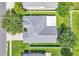 An aerial view of the house showing the roof, backyard and lawn at 1031 Seneca Trl, St Cloud, FL 34772