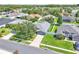An aerial view of the community with green lawns and mature trees at 1031 Seneca Trl, St Cloud, FL 34772
