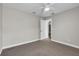 Bedroom featuring neutral walls and carpeting, plus fan and closet at 1031 Seneca Trl, St Cloud, FL 34772