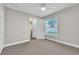 Neutral bedroom features carpeting, window with a view, and ensuite at 1031 Seneca Trl, St Cloud, FL 34772