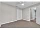 Bedroom featuring neutral walls and carpeting, plus fan and closet at 1031 Seneca Trl, St Cloud, FL 34772