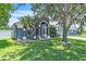Charming single-story home featuring a manicured lawn, arched entryway and an attached two-car garage at 1031 Seneca Trl, St Cloud, FL 34772