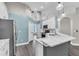 Inviting kitchen with white cabinetry, marble counters, and stainless steel appliances at 1031 Seneca Trl, St Cloud, FL 34772