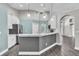 Inviting eat-in kitchen with white cabinetry, stainless steel appliances, and marble countertops at 1031 Seneca Trl, St Cloud, FL 34772