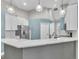 Eat-in kitchen featuring stainless steel appliances, breakfast bar, and pendant lighting at 1031 Seneca Trl, St Cloud, FL 34772