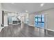 Open concept living area featuring access to the kitchen and lanai at 1031 Seneca Trl, St Cloud, FL 34772