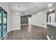 Spacious living room featuring wood-style flooring, abundant natural light and neutral paint at 1031 Seneca Trl, St Cloud, FL 34772