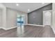 Bright, open floor plan featuring a sliding glass door and wood-style flooring at 1031 Seneca Trl, St Cloud, FL 34772