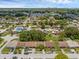 Community with a sparkling pool, well-maintained homes, lush landscaping, and serene neighborhood streets at 1032 Calanda Ave # 1032, Orlando, FL 32807