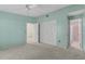 A bedroom featuring neutral carpet, a ceiling fan, and a closet with bi-fold doors at 1032 Calanda Ave # 1032, Orlando, FL 32807